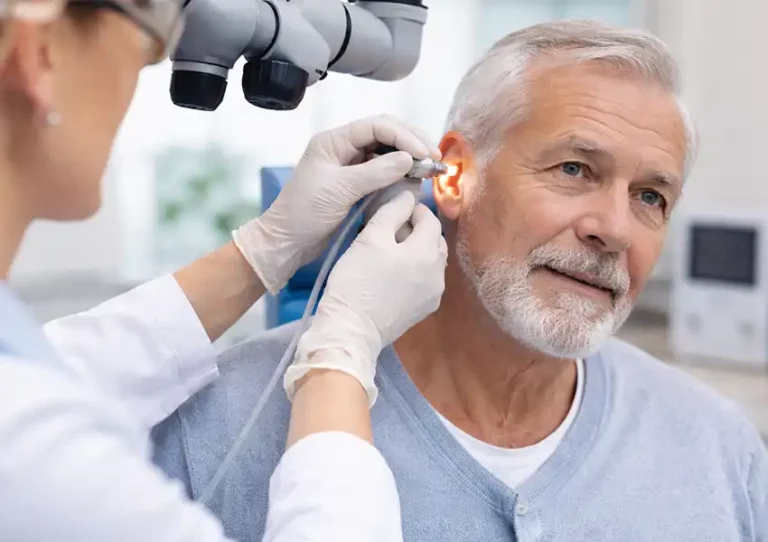 Earwax removal appointments in Northern Ireland with a patient receiving microsuction treatment in a clinic